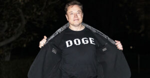 Nearly One Billion of Elon Musk's DOGE 'Savings' Disappear Overnight Elon Musk wearing DOGE shirt