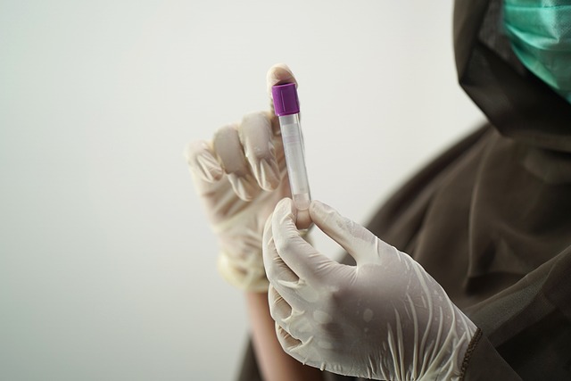 doctor holding blood vial