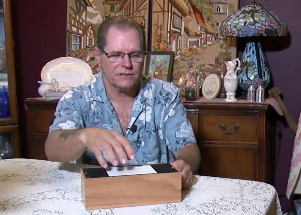 Jim Stauffer with the ashes of his mother