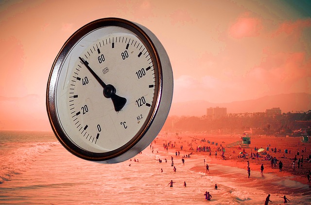 thermometer and beach on hot day