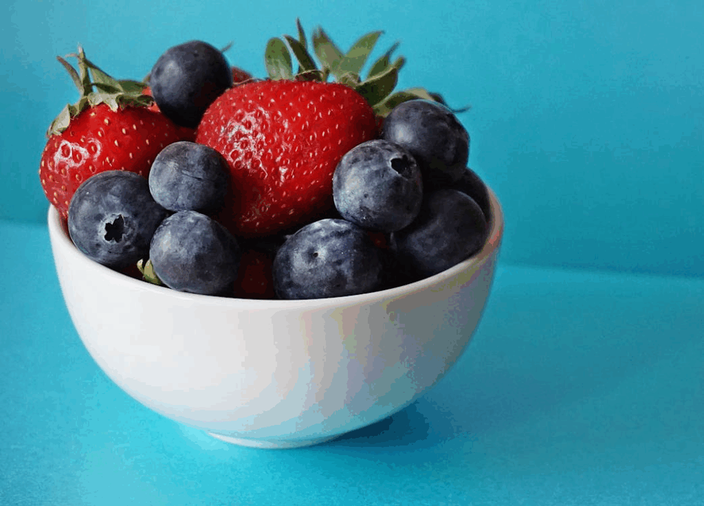 Blueberries and Strawberries in White Ceramic Bowl