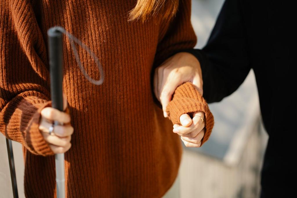 Photo of Man Holding on Woman's Arm