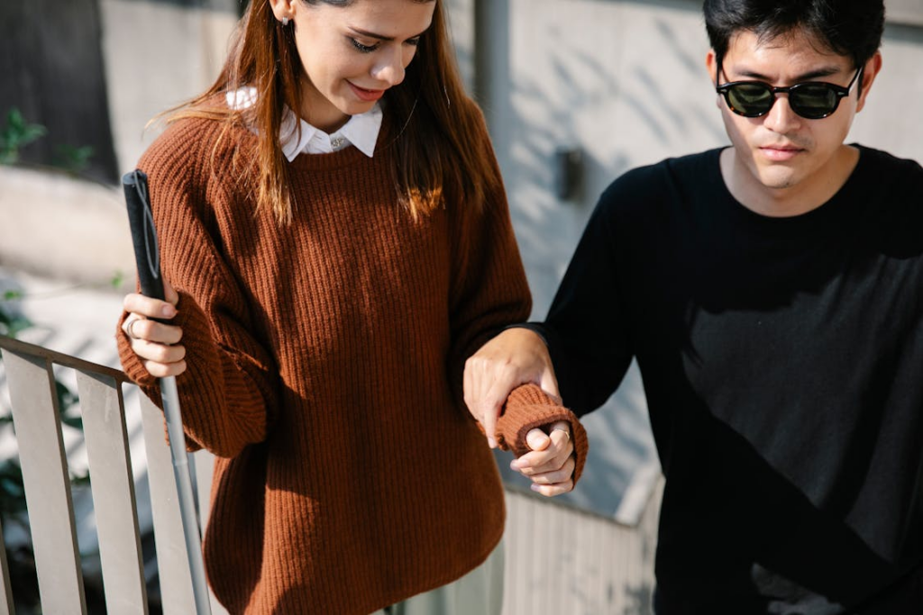 Photo of Man Holding to Woman's Arm