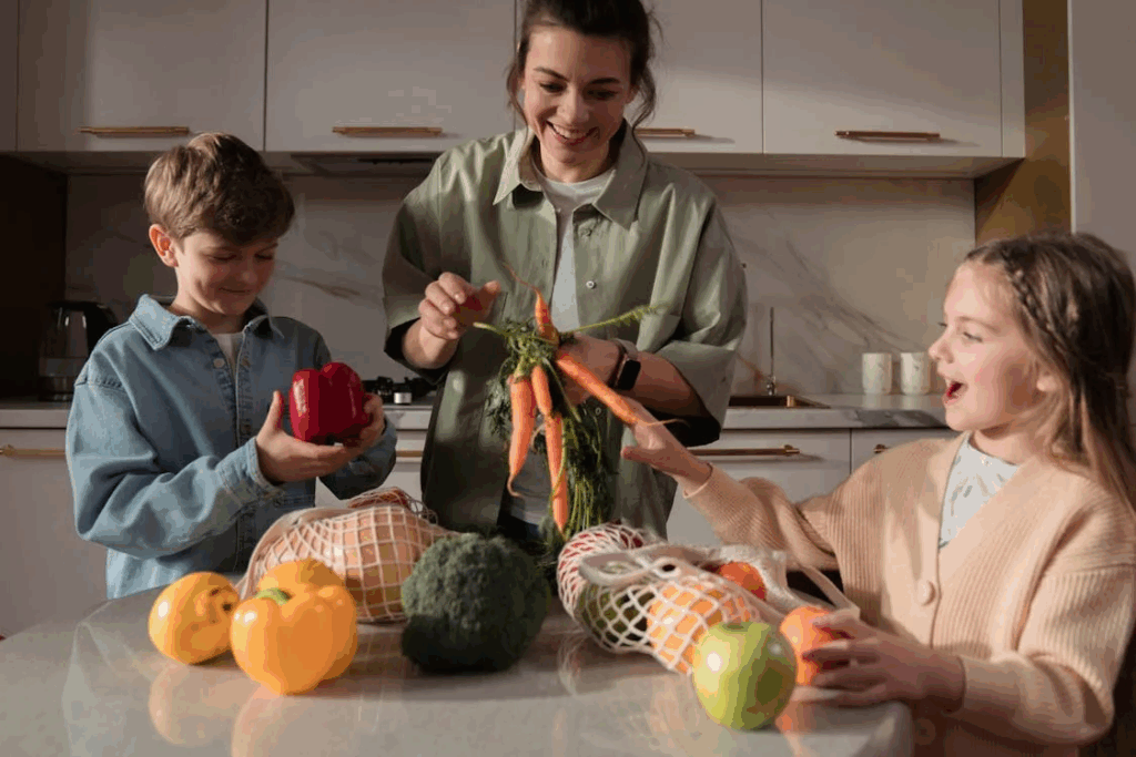 A Mother and Her Children Unpacking Goods in the Kitchen