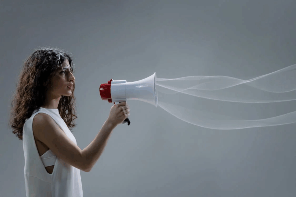 Wavy Haired Woman Holding a Megaphone