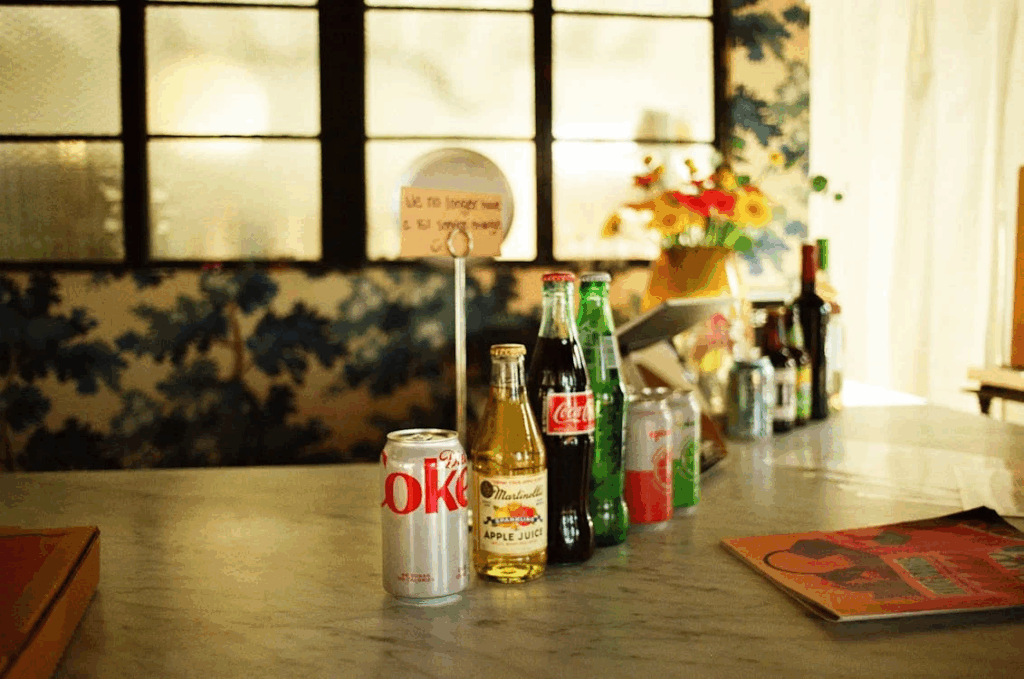Cans and Bottles of Drinks in a Row