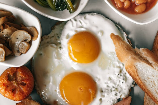 Sunny Side Up Eggs On White Ceramic Plate