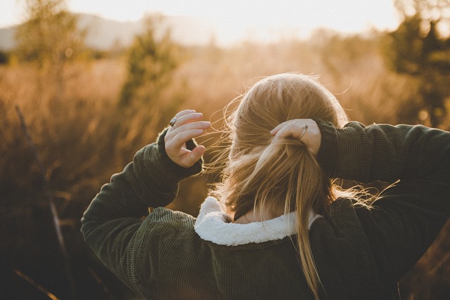 woman holding her hair