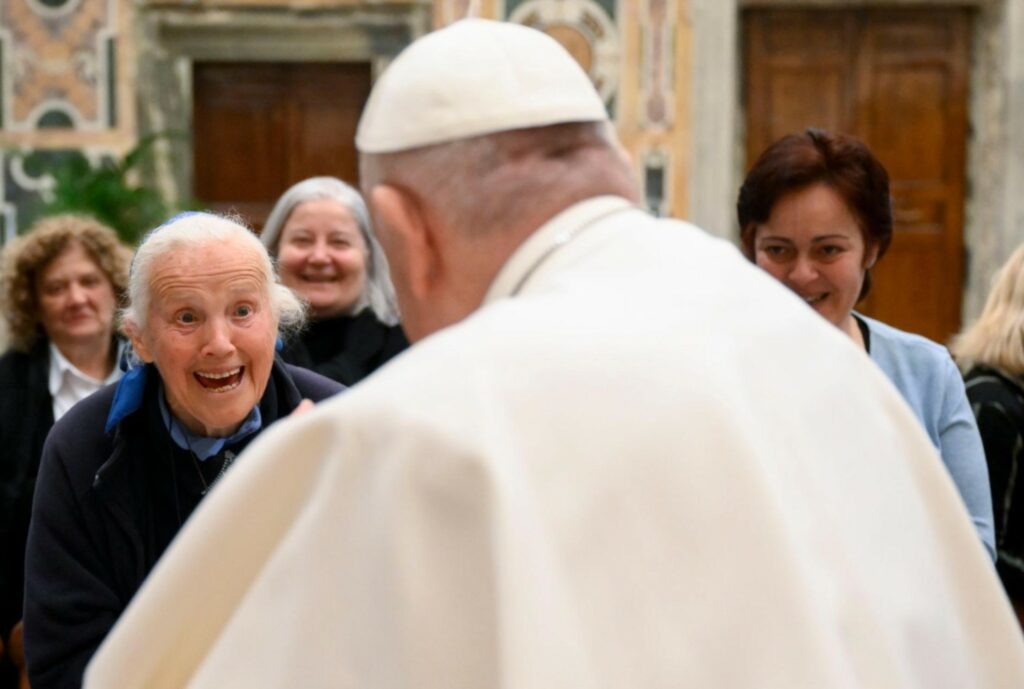 Surprised face of Sister Geneviève while talking to Pope Francis
