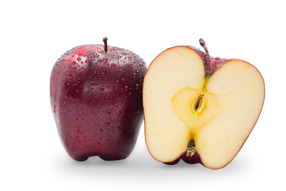 Fresh whole and half organic Red Delicious apples with water drop on white isolated background, clipping path. Red apple is antioxidant fruit and high vitamin, delicious for diet snack and salad.