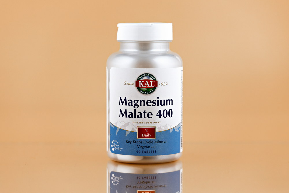 Novosibirsk,Russia - May, 11 - 2021: magnesium malate tablets in the jar. dietary supplement editorial photo