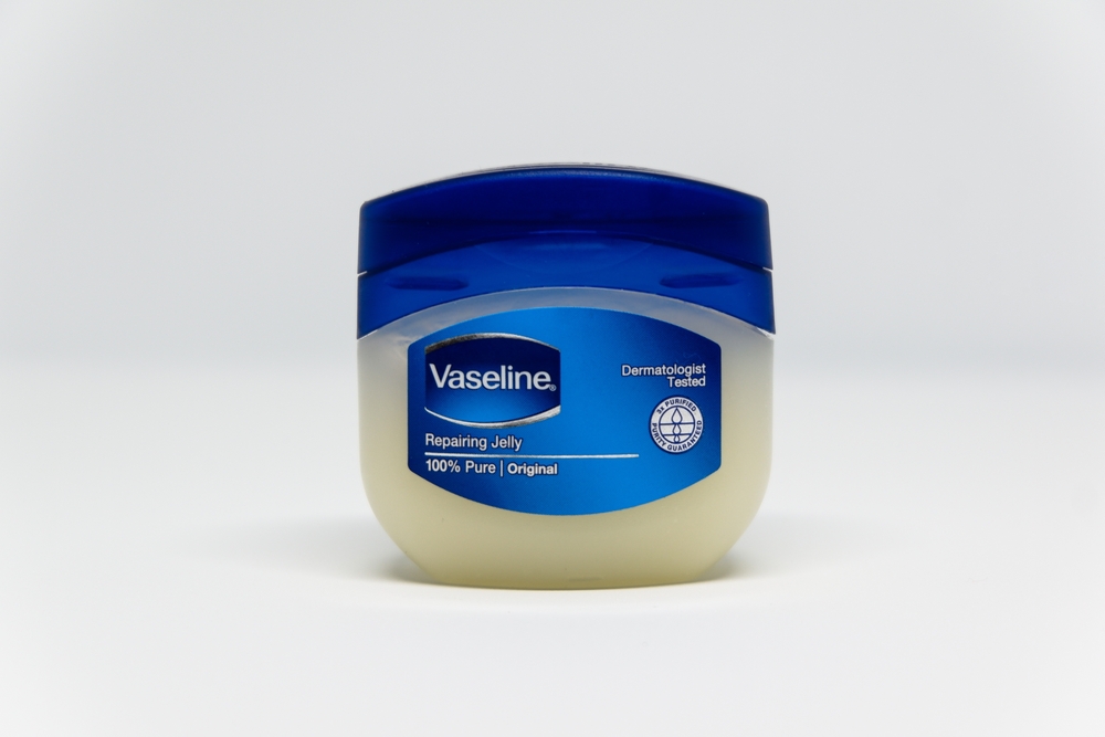 Sidoarjo, Indonesia - August 7, 2021: Body care jelly cream product from the Vaseline brand which is suitable for dry skin, on a white background