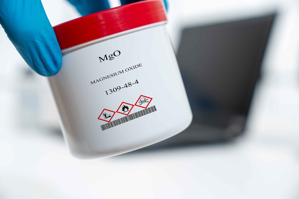 MgO magnesium oxide magnesia periclase CAS 1309-48-4 chemical substance in white plastic laboratory packaging