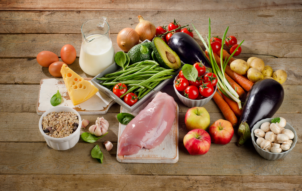 Balanced diet, cooking and healthy food concept on wooden table. View from above