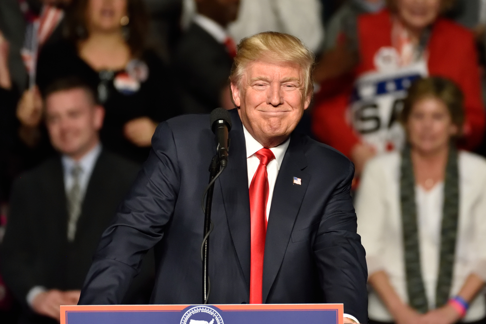 HERSHEY, PA - DECEMBER 15, 2016: President-Elect Donald Trump smiles as he pauses during a speech at a "Thank You" tour rally held at the Giant Center.
