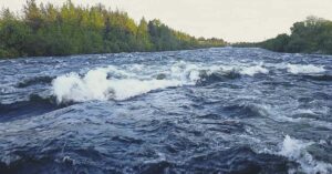 Aerial View from Drone of Rough Niva River flowing through the Kandalaksha Town in Russia