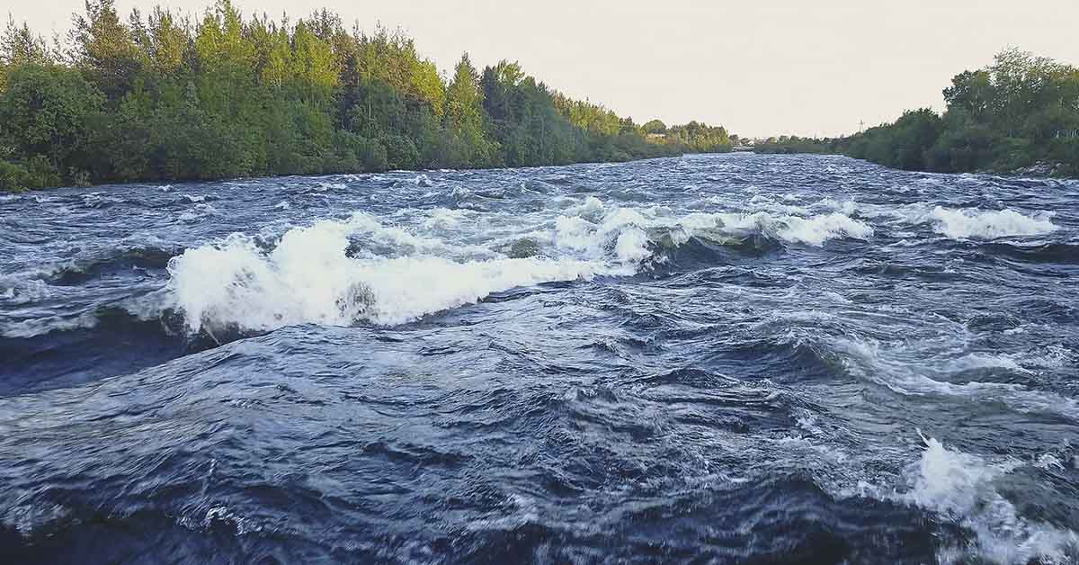 Aerial View from Drone of Rough Niva River flowing through the Kandalaksha Town in Russia