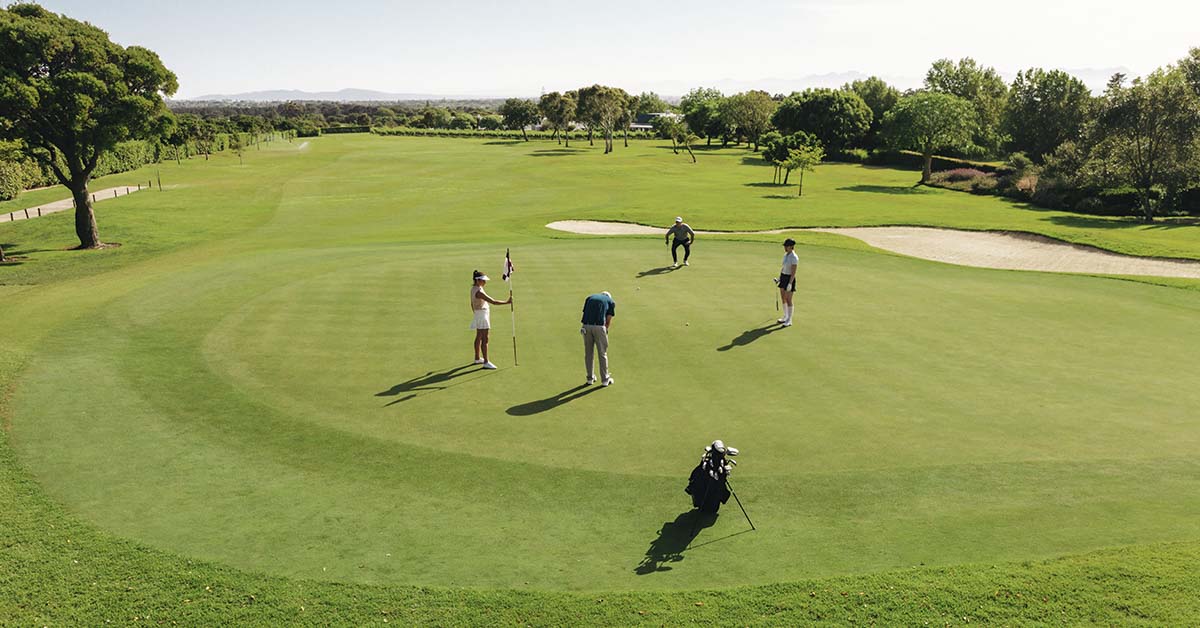 People playing golf on a golf course