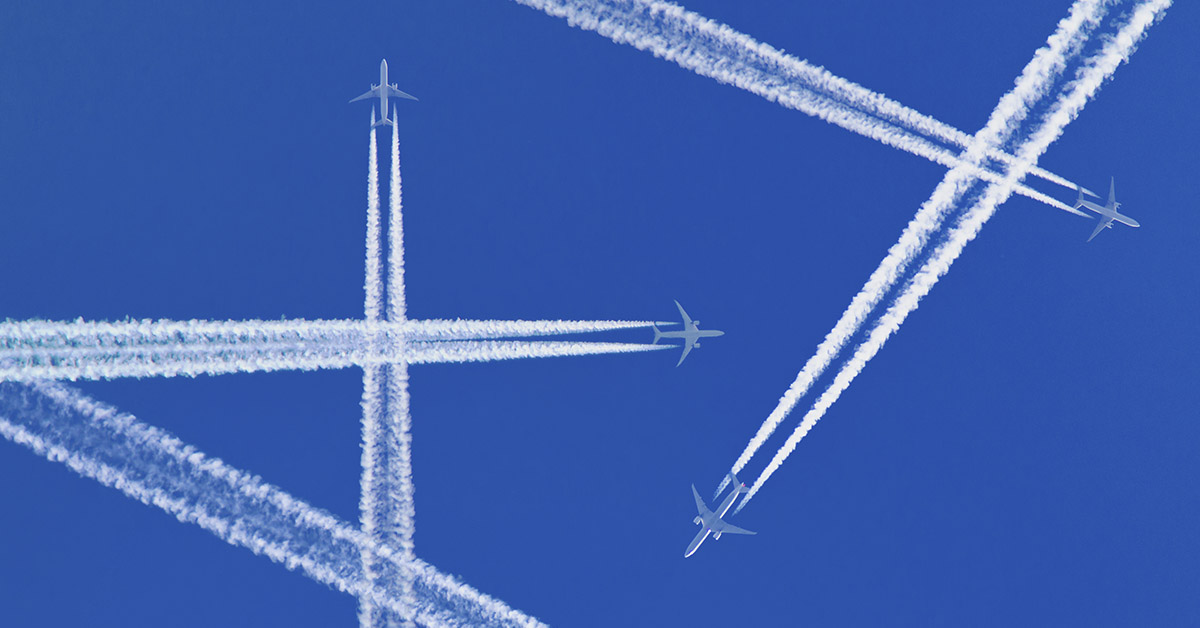 Jets flying in sky leaving contrails behind them as they fly