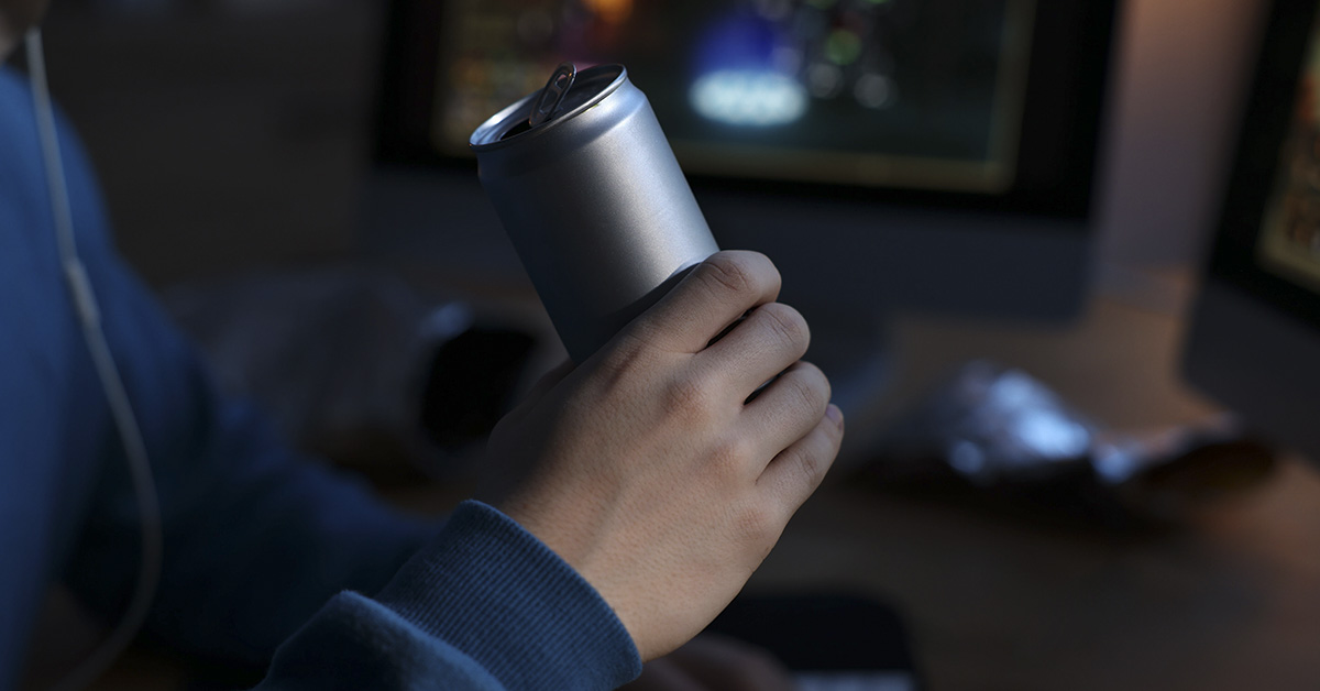 Person holding an energy drink. A common source of taurine