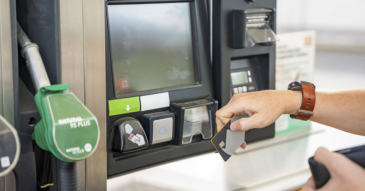 person using a credit card for gas at the pump