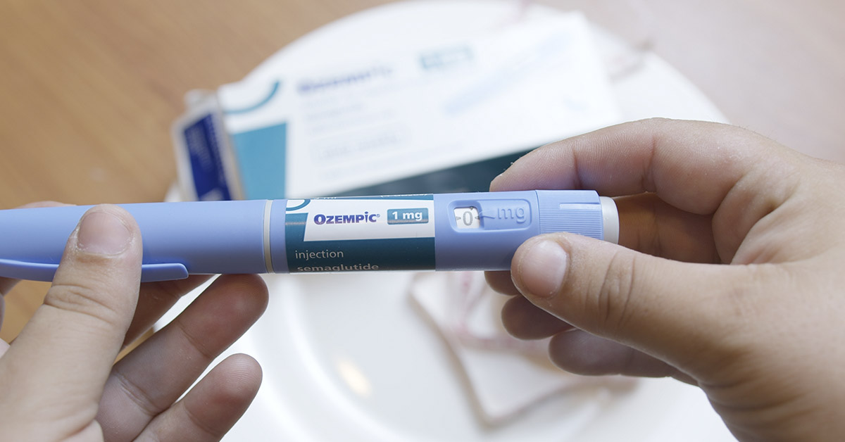 person holding an Ozempic injection pen