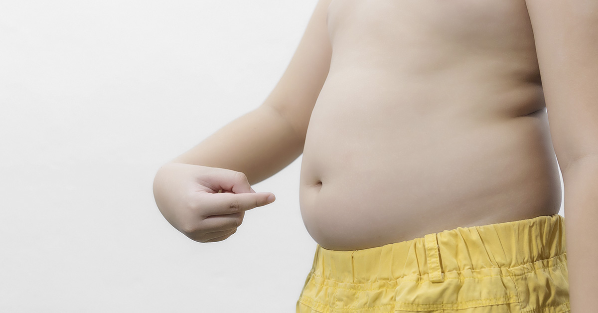 Obese fat Asian boy overweight on white background, Health care concept