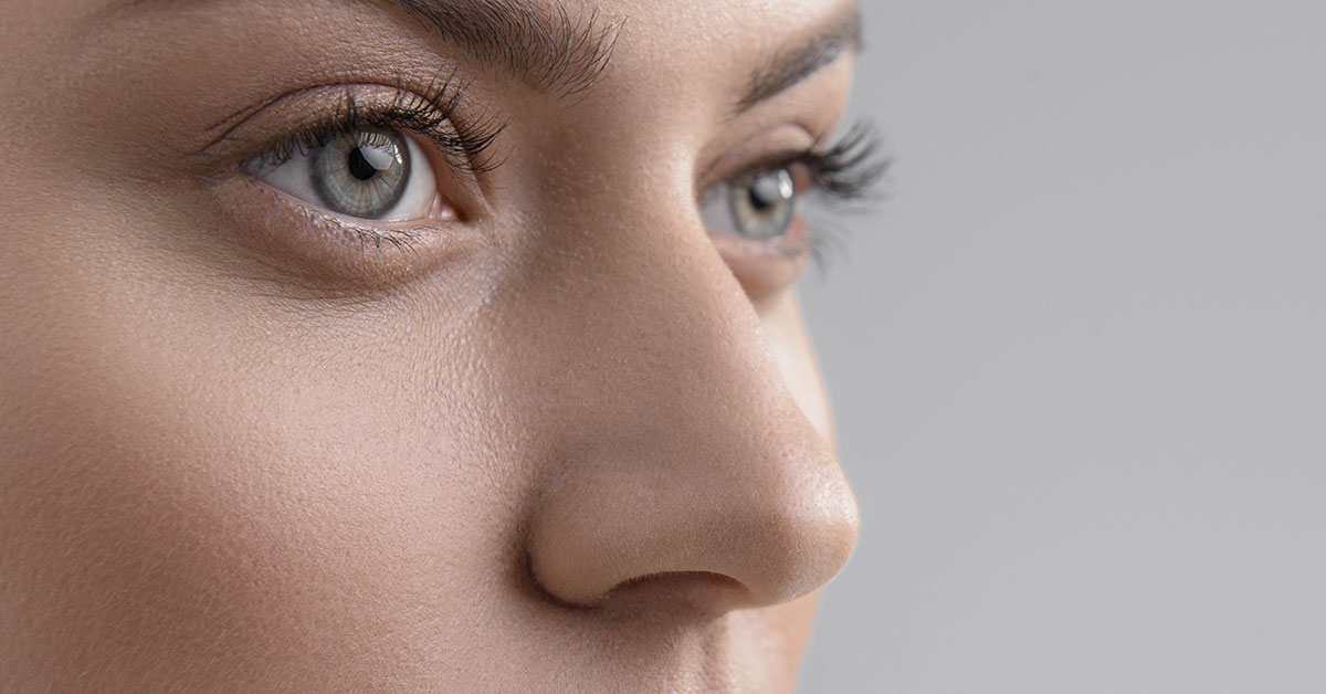 close up of woman's face including eyes and nose