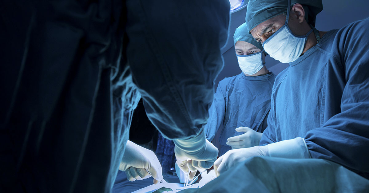 Surgeons operating on a patient