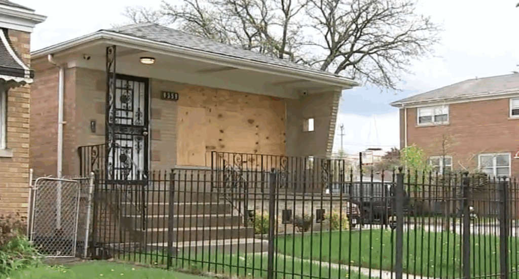 Marco Velazquez's South Side Chicago house with boarded-up windows and security door, the actual property where he discovered unwanted residents had moved in when his realtor arrived with a potential buyer.