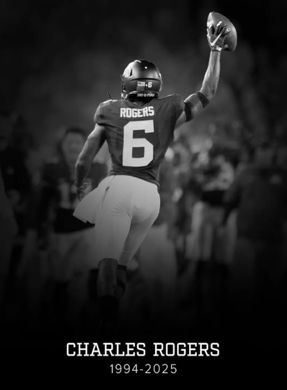Black and white memorial image of Charles Rogers (#6) holding up a football, with "CHARLES ROGERS 1994-2025" text below, honoring the athlete who died during the Brooklyn Half Marathon.