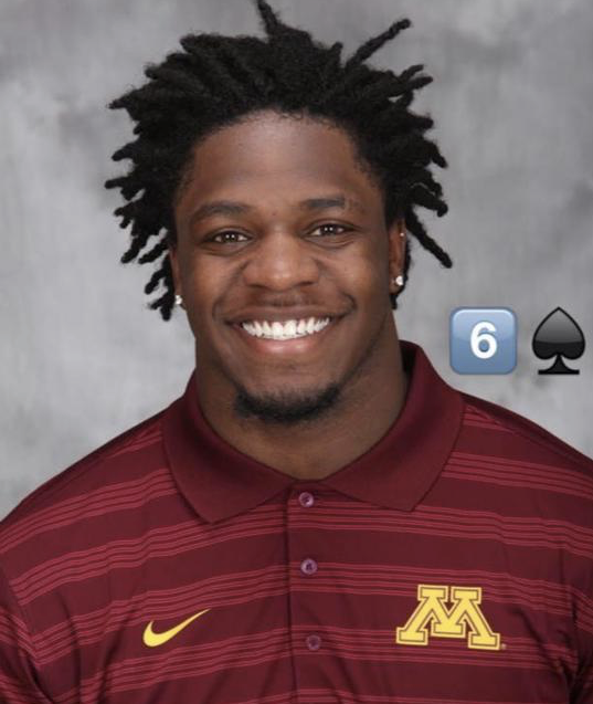 Charles Rogers smiling in his University of Minnesota Golden Gophers polo shirt.