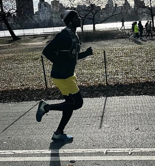 Charles Rogers running outdoors in athletic gear, training for the Brooklyn Half Marathon that would become his final race.