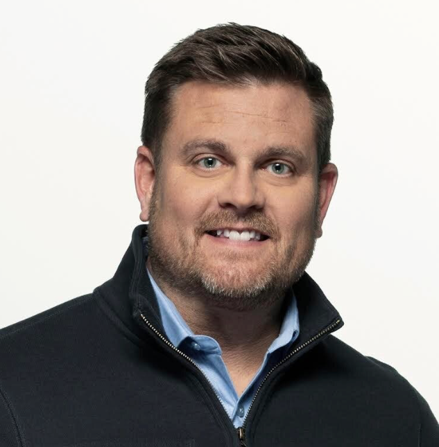 Professional headshot of Brian Thompson, the UnitedHealthcare CEO who was killed in December 2024, symbolizing the corporate leadership at the center of America's healthcare crisis.