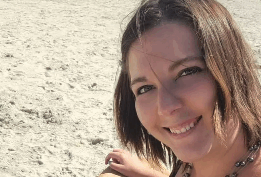 Brianna Lafferty on a beach looking relaxed and happy.
