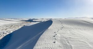Humanity’s Earliest Footprints in the Americas Reveal a New Chapter of History Foot steps along a cliffside in White Sands National Park. Solo traveler path in the desert of New Mexico.