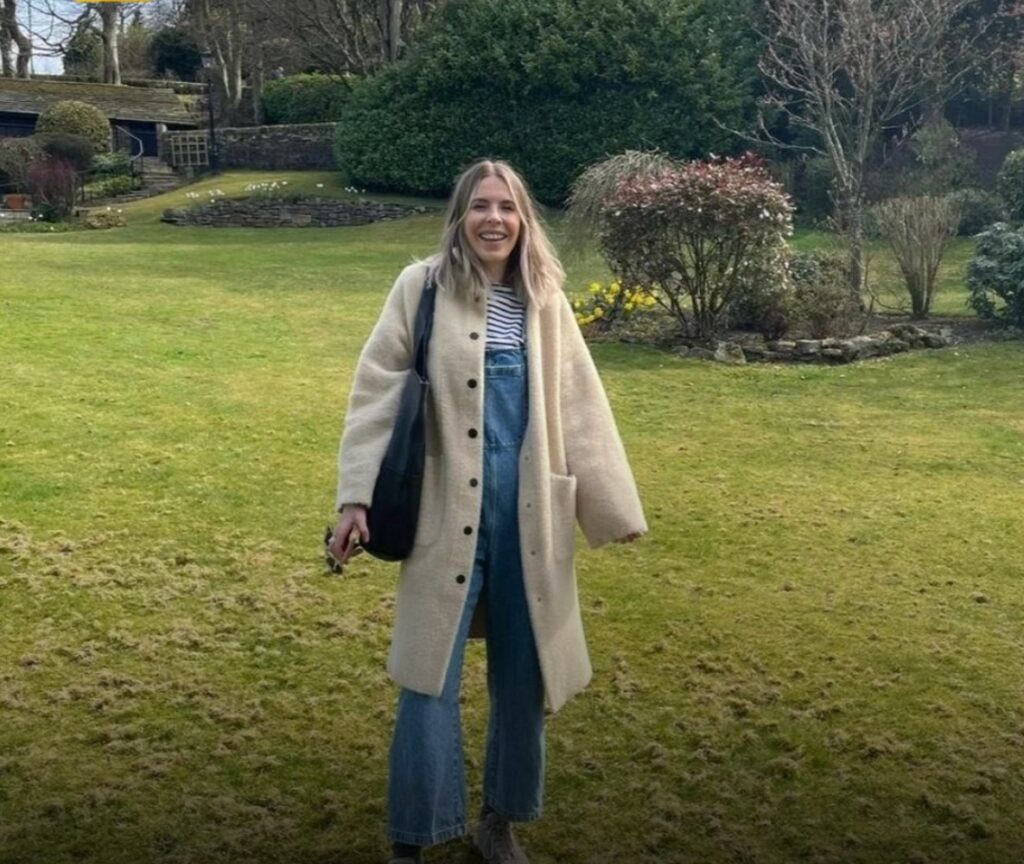 Gemma smiling in a garden