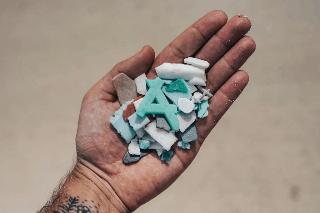 A Person with Plastic Bits Pieces on Hand