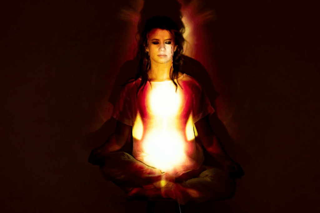 Woman in Red Dress Holding Fire