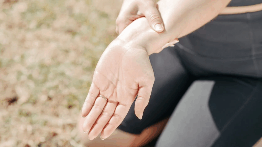 Close-Up Photo of a Woman Stretching Her Wrist
