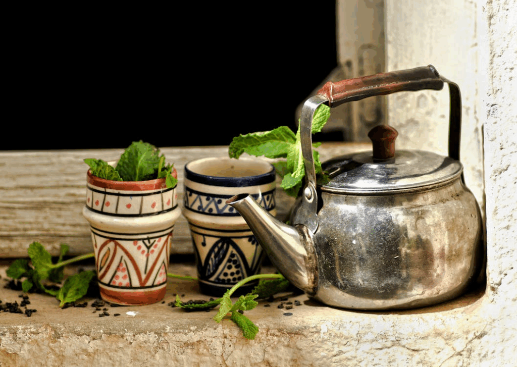 Traditional Moroccan Tea Setup with Mint Leaves