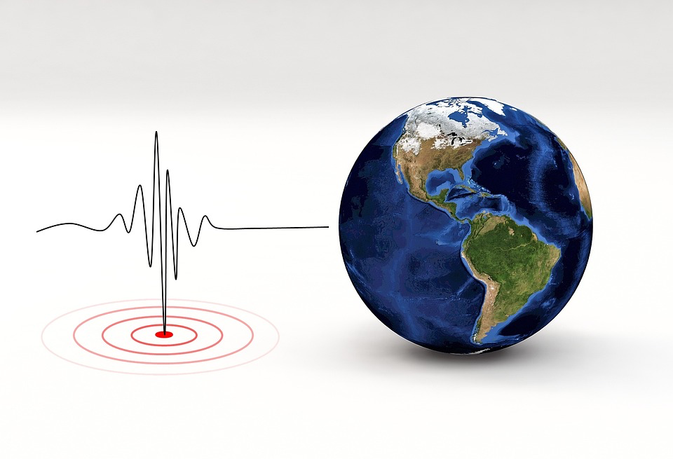 A conceptual illustration shows Earth with the Americas visible, accompanied by seismic wave patterns and concentric circles emanating from a central point. This scientific imagery represents the sophisticated monitoring systems and geological data that real earthquake experts use instead of dream-based predictions.