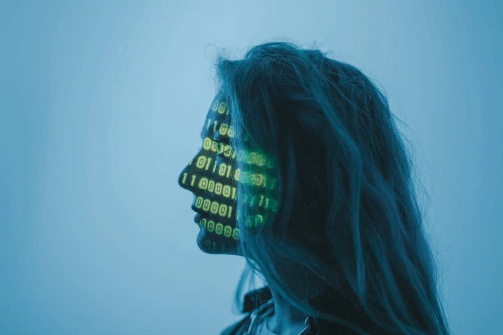Silhouette of person with binary code projection on face, representing how UnitedHealthcare uses AI and computer systems to make medical coverage decisions that affect millions of patients.
