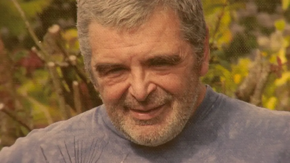 Les Milne outdoors with gray hair and beard. This shows him during the years when his scent changes puzzled Joy.