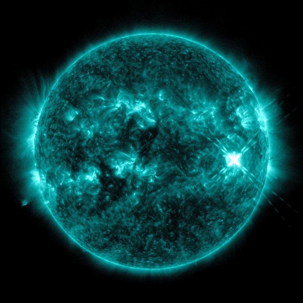 Solar flare captured in extreme ultraviolet light showing intense magnetic field activity on the sun.