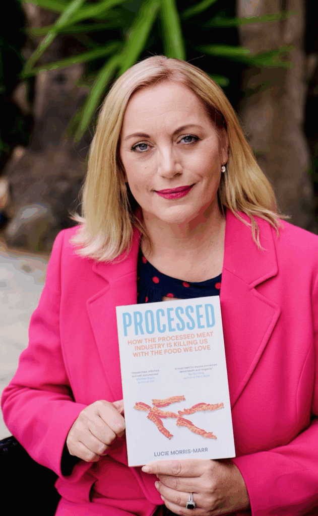 Lucie Morris-Marr holdind her book Processed, written about the processed meat industry and it's link to bowel cancer. 