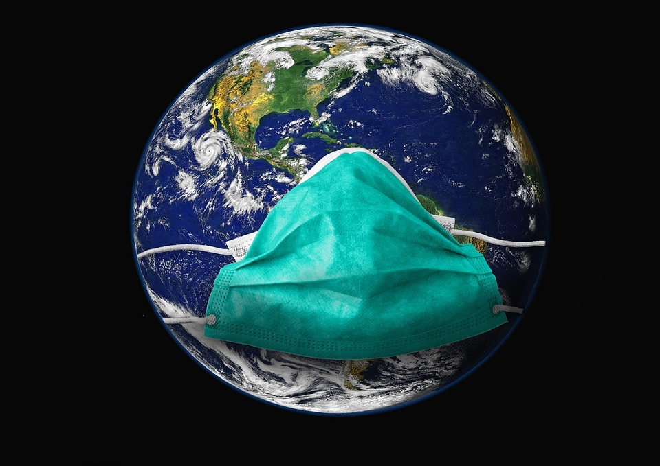 Image of Earth with teal surgical mask overlaid, representing global pandemic health measures.