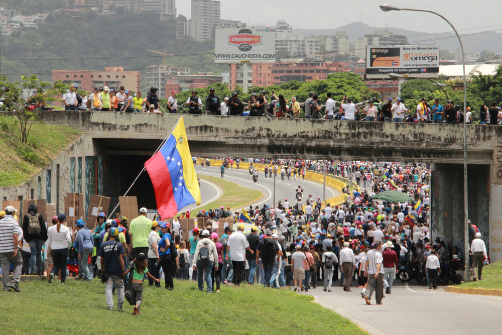Caracas/Venezuela-04/26/2017: Protesters closed a highway in Caracas while participating in the event called The mother of all protests in Venezuela against Nicolas Maduro government