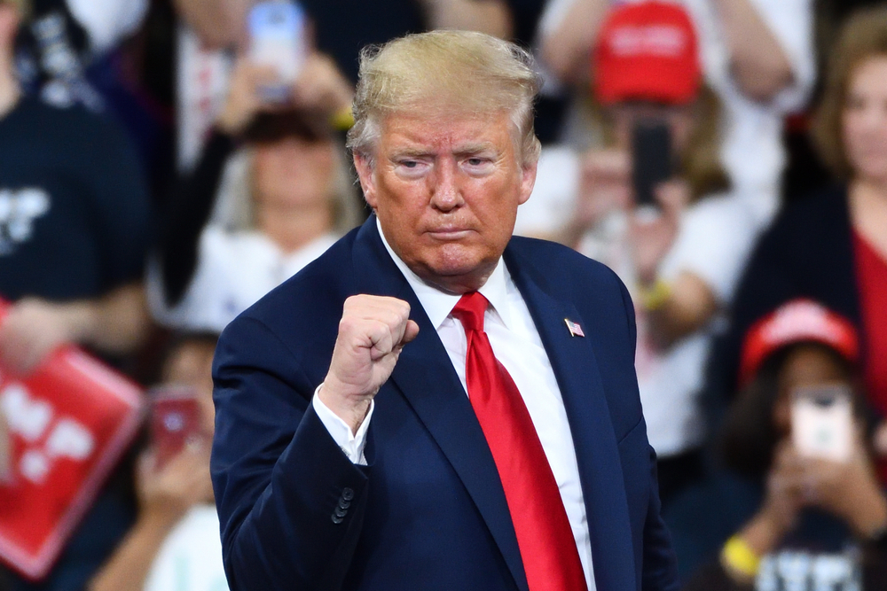 HERSHEY, PA - DECEMBER 10, 2019:President Donald Trump gestures the confident fist pump on stage at a campaign rally at the Giant Center.
