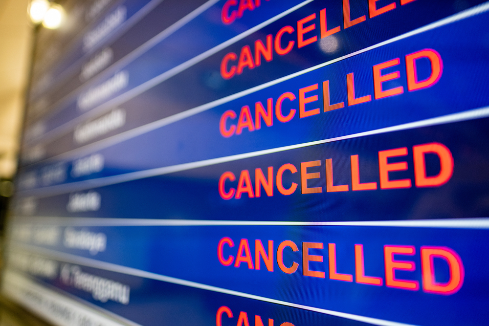 Airport screen indicating cancelled flights due to the Coronavirus pandemic